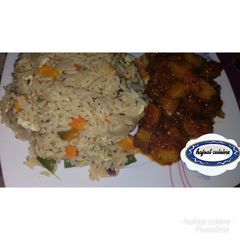 A picture of White jollof rice with potato sous.