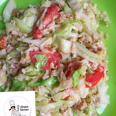 A picture of Steamed cabbage with egg.