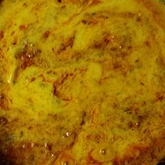 A picture of Kadhi with tomato.
