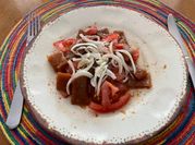 Una foto de cochayuyo tomate