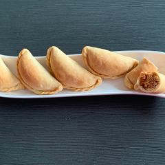 A picture of Baked Sattu Ghujiya.