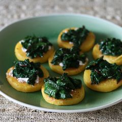 A picture of Polenta with goat cheese + greens.