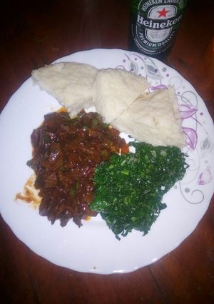 A picture of Liver served with ugali and greens.