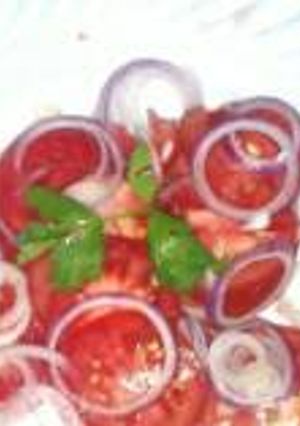 A picture of Tomato & onion salad.