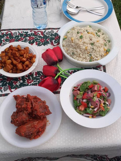 A picture of Fried rice with peppered chicken.