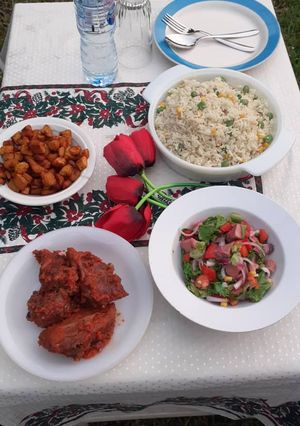 A picture of Fried rice with peppered chicken.