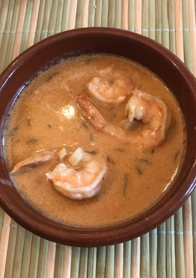 Una foto de Camarones envinados