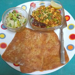 A picture of An Indian Bento Box --- Ajwain Paratha 🫓, Paneer Bhurji 🫛🪅 & A Simple Cucumber Salad 🥒🥒.