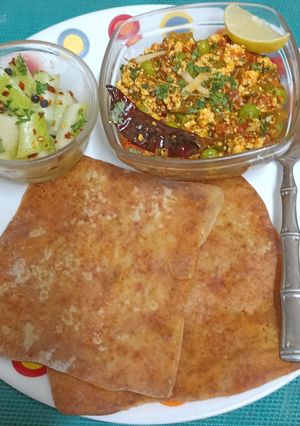 A picture of An Indian Bento Box --- Ajwain Paratha 🫓, Paneer Bhurji 🫛🪅 & A Simple Cucumber Salad 🥒🥒.