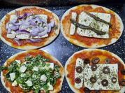 Una foto de pizzetas sabores