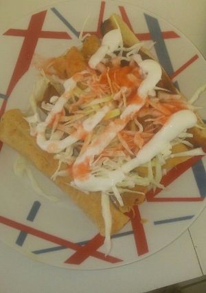Una foto de Tacos dorados