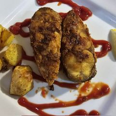 A picture of Fried mackerel with herbed potatoes.