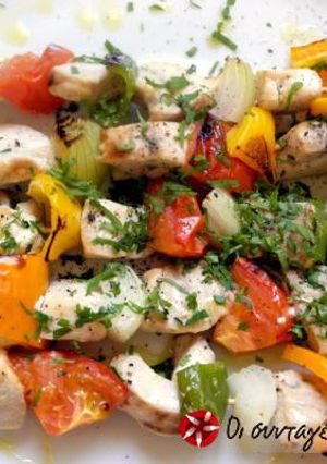 A picture of Swordfish souvlaki with vegetables.