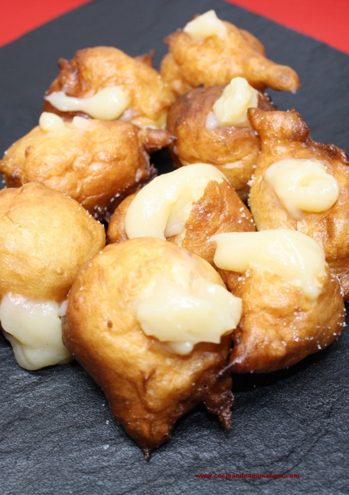 Una foto de Buñuelos de viento rellenos de crema pastelera