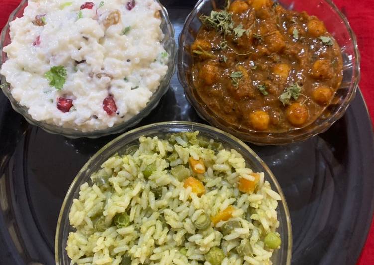 Satvik platter of Pulao chole masala and curd rice