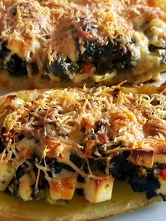Una foto de Zucchini rellenos de espinaca y queso ricotta