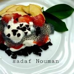 A picture of Fresh yogurt with fruit and chia seed.