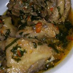 A picture of Chicken peppersoup with uziza leaf.