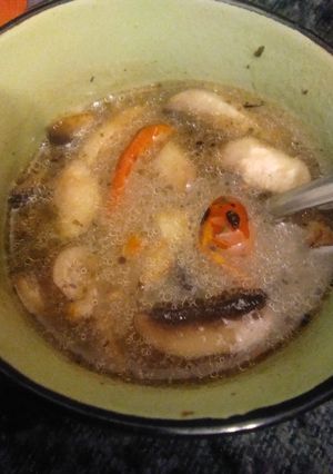 A picture of Miso soup with mushrooms.