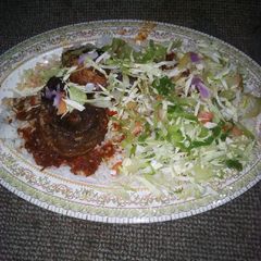 A picture of Rice with fish and cabage.