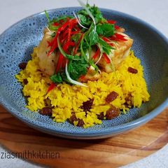 Yellow Rice With Raisin Serve With Frypan Fish Barramundi Fillet A picture of Yellow Rice With Raisin Serve With Frypan Fish Barramundi Fillet.