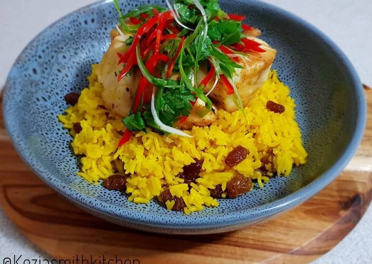 Yellow Rice With Raisin Serve With Frypan Fish Barramundi Fillet