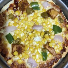 A picture of Corn Paneer pizza.