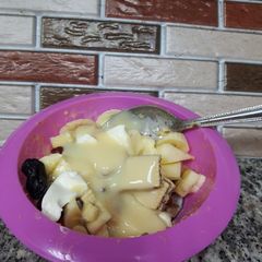 A picture of Fruit Salad with Cake and wafer.