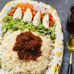 A picture of Rice & Stew with Salad.