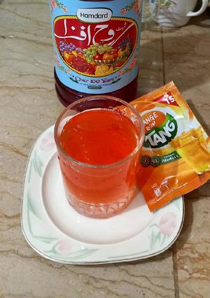 A picture of Rooh afza with orange 🍊 tang.