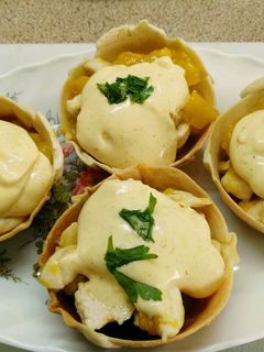 Una foto de Tartaletas de pollo y mango al curry