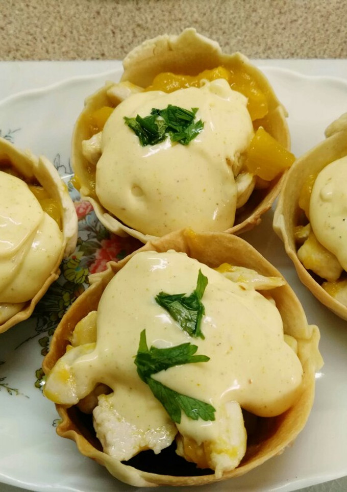 Una foto de Tartaletas de pollo y mango al curry