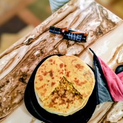 A picture of Aloo Paratha (Stuffed Flatbread).