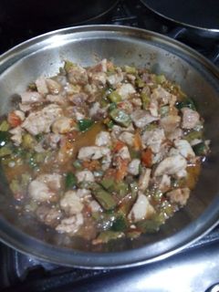 A picture of Pork with Nopales and Pico de Gallo.