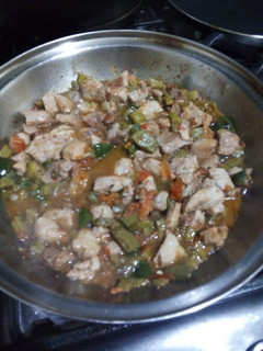 A picture of Pork with Nopales and Pico de Gallo.