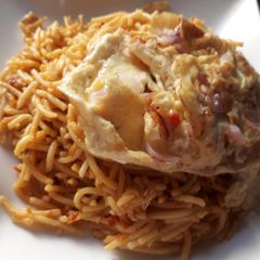 A picture of Pasta with fried egg.