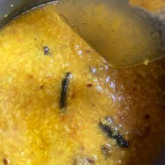 A picture of Moong dal with fish head.