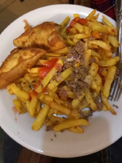 A picture of Chips with minced meat.