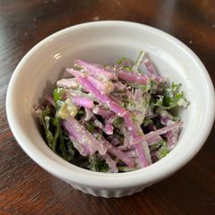 Mizuna salad with tofu Caesar dressing A picture of Mizuna salad with tofu Caesar dressing.