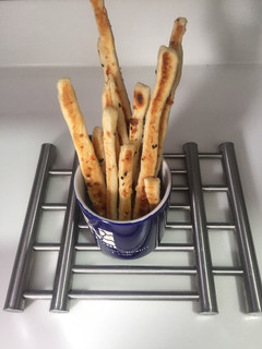 A picture of Garlic bread sticks.
