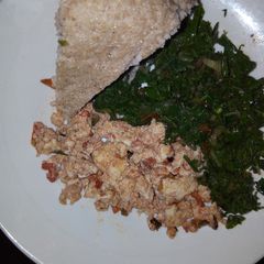 A picture of Fried Eggs, Kales and Brown Ugali.