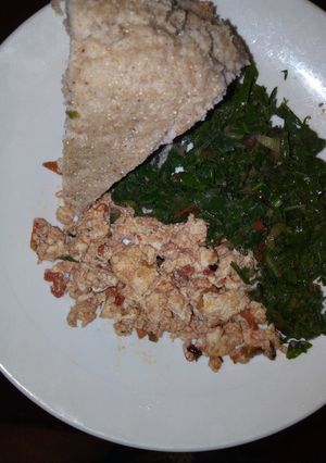 A picture of Fried Eggs, Kales and Brown Ugali.