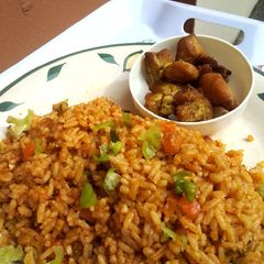 A picture of OrangeGreen Jollof Rice.