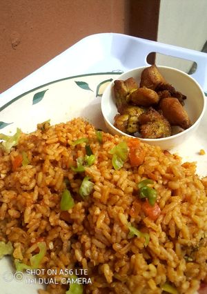 A picture of OrangeGreen Jollof Rice.