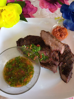 A picture of Lamb roast with chimmichurri.