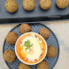 A picture of Falafel and hummus.
