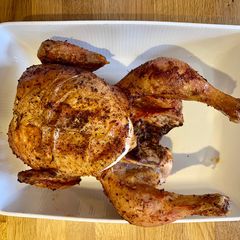 A picture of Beer can Chicken on the Braai.