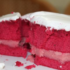 A picture of Red Velvet Cake with White frosting.