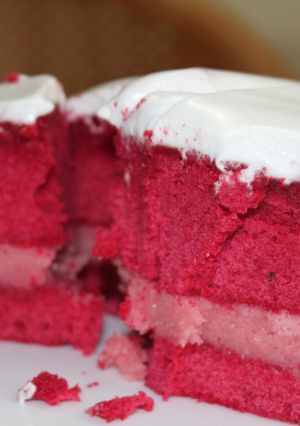 A picture of Red Velvet Cake with White frosting.