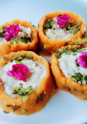 A picture of Ladoo cups with Rabri filling busicuits crums.